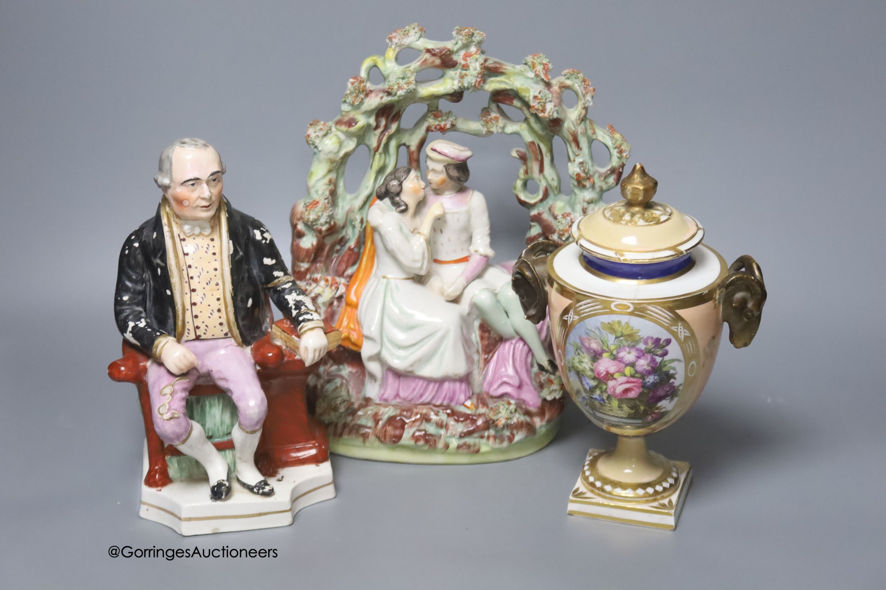 An early 19th century Derby vase, associated cover, a Staffordshire seated gentleman and an arbour group, tallest 25cm